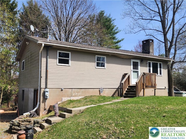 1007 Calypso, Wayne, PA 18436 - back of property featuring a chimney and a lawn