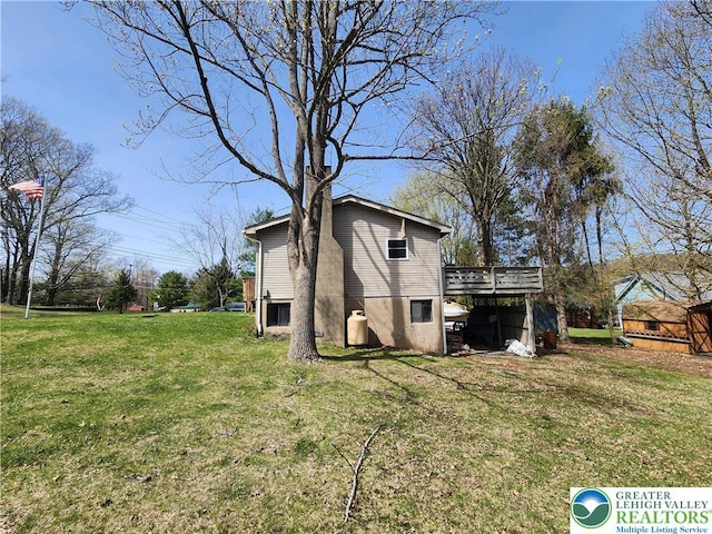 1007 Calypso, Wayne, PA 18436 - back of house with a wooden deck and a yard