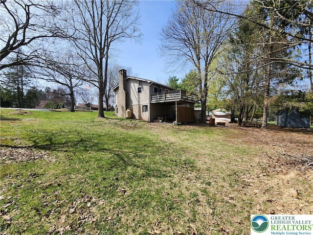 1007 Calypso, Wayne, PA 18436 - view of green lawn featuring a wooden deck