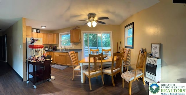 1007 Calypso, Wayne, PA 18436 - dining room featuring heating unit, dark wood-style flooring, a ceiling fan, lofted ceiling, and a glass covered fireplace