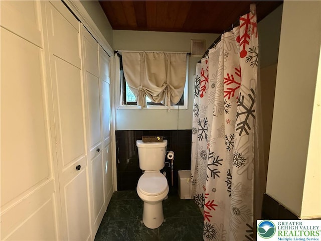 193 Canterbury Rd, Lehman Twp, PA 18324 - bathroom featuring tile patterned flooring, tile walls, wood ceiling, and a shower with curtain