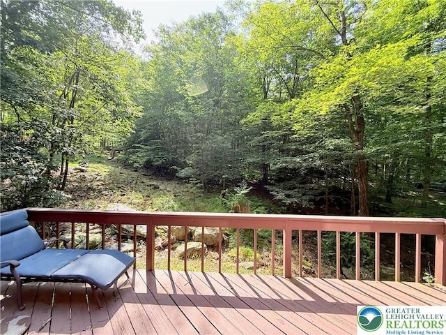 193 Canterbury Rd, Lehman Twp, PA 18324 - wooden deck featuring a forest view