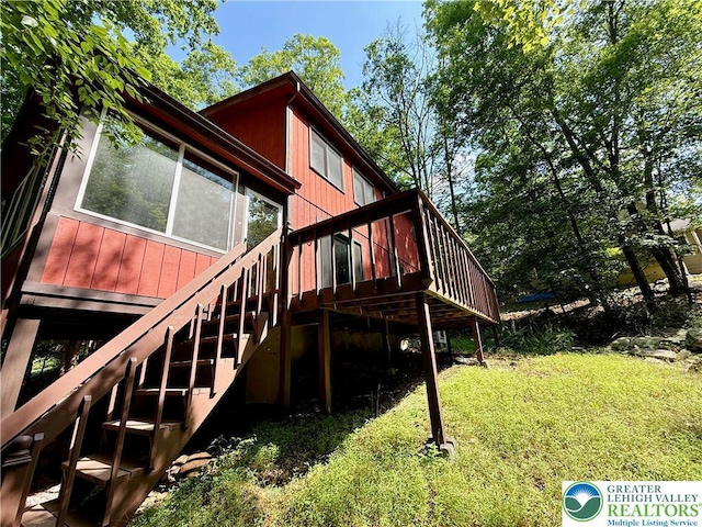 193 Canterbury Rd, Lehman Twp, PA 18324 - view of home's exterior featuring a lawn, a wooden deck, and stairs