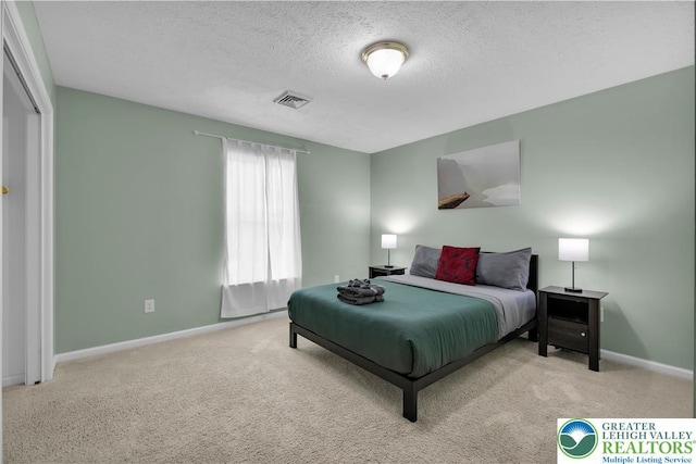 672 Clearview St, Tobyhanna Twp, PA 18334 - carpeted bedroom with a textured ceiling and baseboards