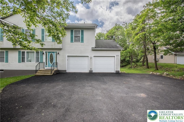 672 Clearview St, Tobyhanna Twp, PA 18334 - view of front facade with asphalt driveway and an attached garage