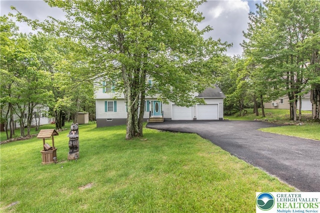 672 Clearview St, Tobyhanna Twp, PA 18334 - view of property hidden behind natural elements featuring asphalt driveway, a garage, and a front lawn