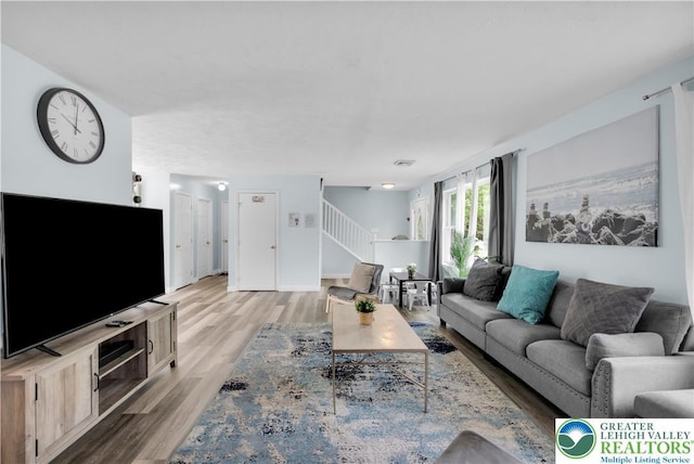 672 Clearview St, Tobyhanna Twp, PA 18334 - living area with wood finished floors and stairway