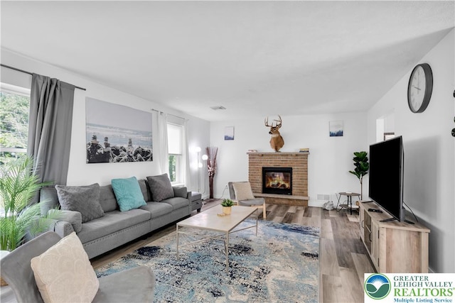 672 Clearview St, Tobyhanna Twp, PA 18334 - living room featuring wood finished floors and a fireplace
