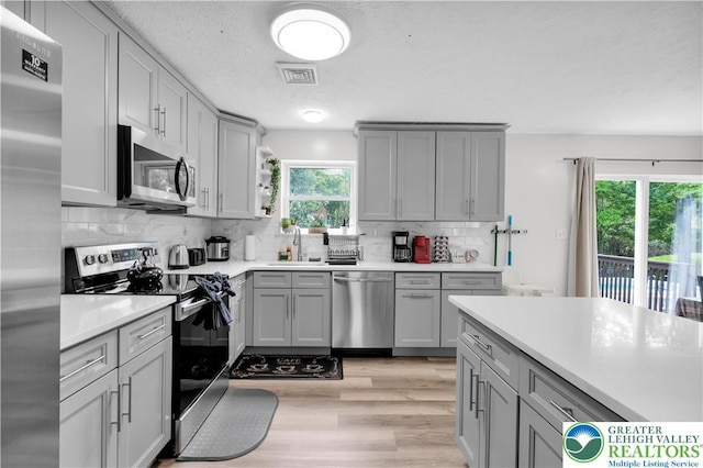 672 Clearview St, Tobyhanna Twp, PA 18334 - kitchen with stainless steel appliances and gray cabinets