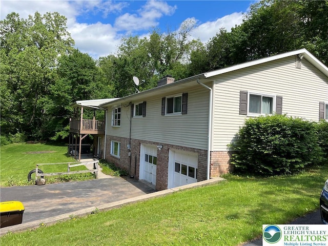 1321 Sheridan Rd, Lower Milford Twp, PA 18036 - view of side of home featuring a garage, a yard, driveway, a chimney, and a deck