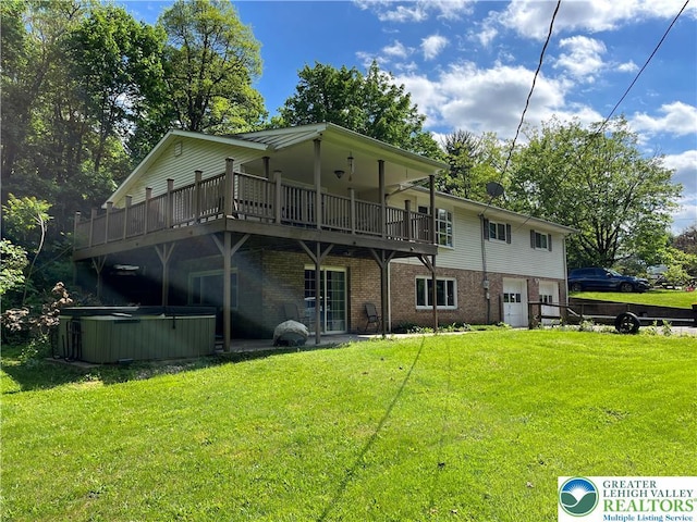 1321 Sheridan Rd, Lower Milford Twp, PA 18036 - back of house with a hot tub, brick siding, a lawn, and a wooden deck