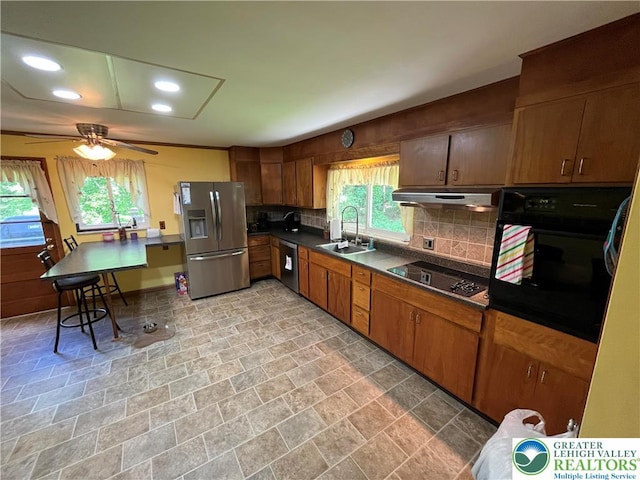 1321 Sheridan Rd, Lower Milford Twp, PA 18036 - kitchen with black appliances, under cabinet range hood, dark countertops, decorative backsplash, and a ceiling fan