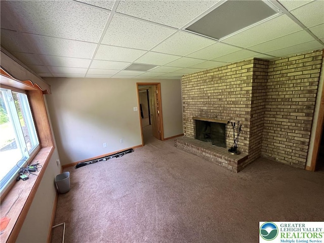 1321 Sheridan Rd, Lower Milford Twp, PA 18036 - unfurnished living room with a drop ceiling, carpet floors, and a brick fireplace