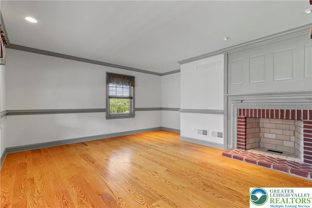 6513 Station Vw, Upper Milford Twp, PA 18092 - unfurnished living room featuring crown molding, wood finished floors, a fireplace, and recessed lighting