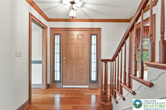 6513 Station Vw, Upper Milford Twp, PA 18092 - entryway with stairs, light wood-type flooring, and ornamental molding