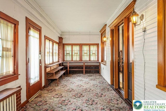 2834 Interchange Rd, Franklin Twp, PA 18235 - unfurnished sunroom featuring carpet floors, radiator, and ornamental molding