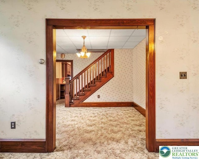 2834 Interchange Rd, Franklin Twp, PA 18235 - staircase featuring wallpapered walls, carpet, a chandelier, and a paneled ceiling