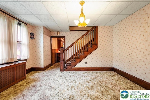 2834 Interchange Rd, Franklin Twp, PA 18235 - stairs featuring radiator heating unit, wallpapered walls, carpet, and a paneled ceiling