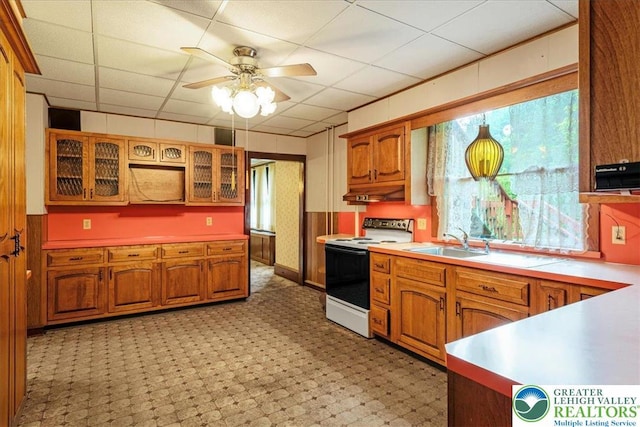 2834 Interchange Rd, Franklin Twp, PA 18235 - kitchen with white electric stove, brown cabinetry, ceiling fan, and a drop ceiling