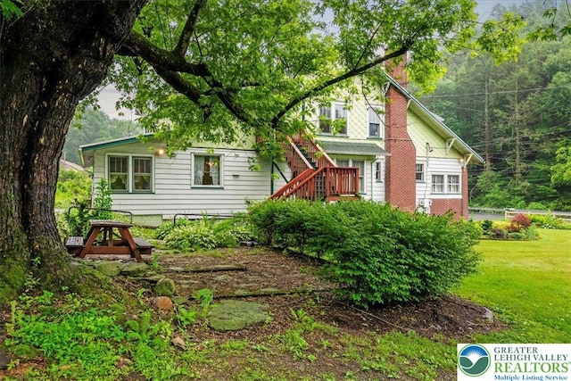 2834 Interchange Rd, Franklin Twp, PA 18235 - view of front of property featuring a chimney, a front lawn, and stairs