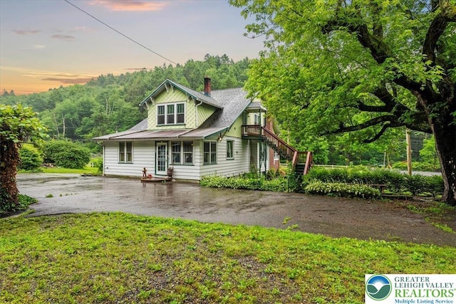2834 Interchange Rd, Franklin Twp, PA 18235 - rear view of property with a chimney, asphalt driveway, a yard, and stairs
