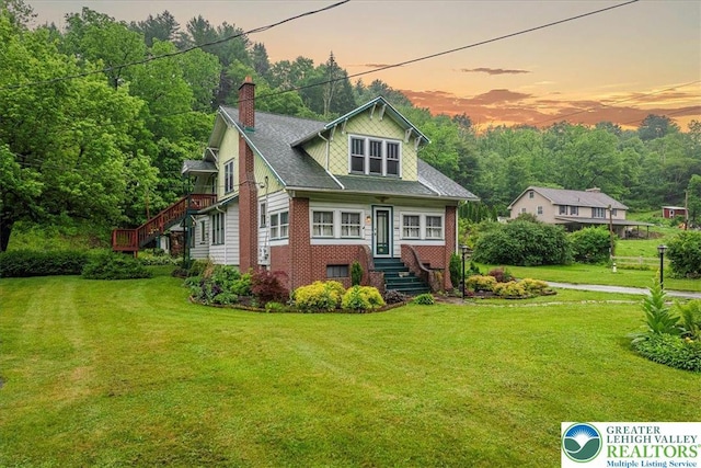 2834 Interchange Rd, Franklin Twp, PA 18235 - view of front of property with stairs, a chimney, a front lawn, and brick siding