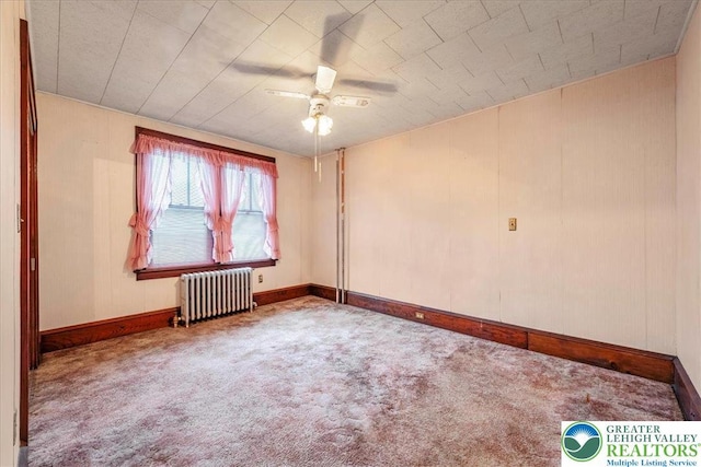 2834 Interchange Rd, Franklin Twp, PA 18235 - spare room featuring radiator heating unit, carpet, and ceiling fan