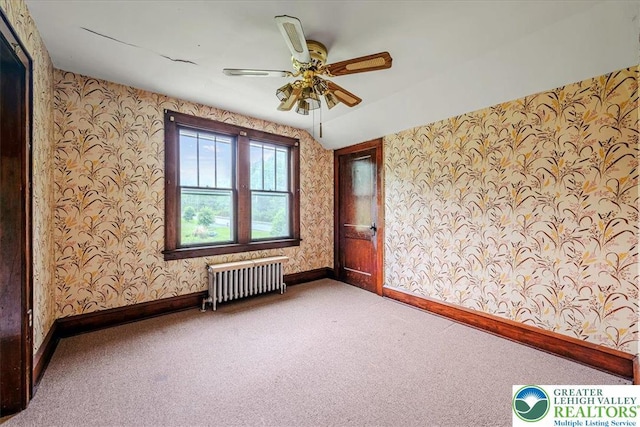 2834 Interchange Rd, Franklin Twp, PA 18235 - carpeted empty room with radiator heating unit, wallpapered walls, and a ceiling fan