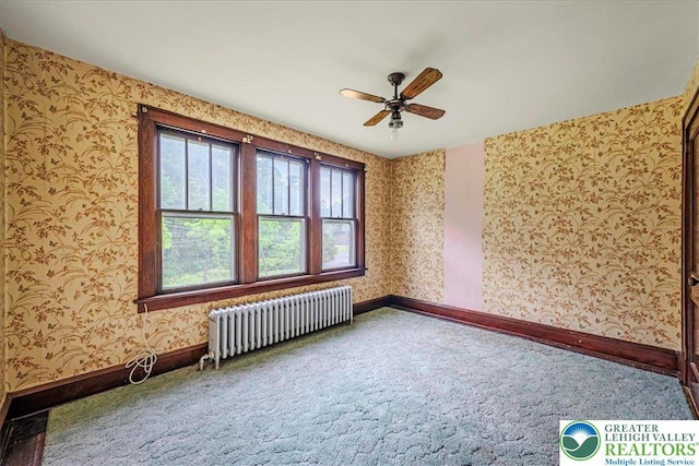 2834 Interchange Rd, Franklin Twp, PA 18235 - carpeted empty room featuring radiator, wallpapered walls, and ceiling fan