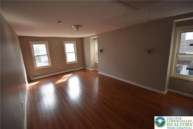 817 Ridge St, Easton, PA 18042 - empty room featuring baseboard heating, healthy amount of natural light, and wood finished floors