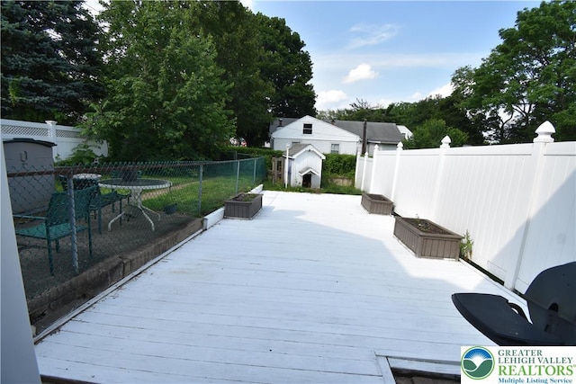 817 Ridge St, Easton, PA 18042 - wooden deck featuring a storage unit