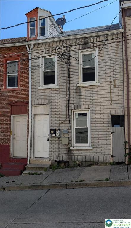 331 N Penn St, Allentown City, PA 18102 - townhome / multi-family property featuring entry steps and brick siding