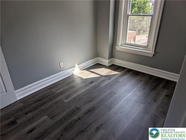 331 N Penn St, Allentown City, PA 18102 - unfurnished room with baseboards and dark wood-type flooring