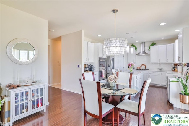 249 Danbury Dr, Upper Nazareth Twp, PA 18064 - dining space featuring dark wood-style floors, a chandelier, and recessed lighting