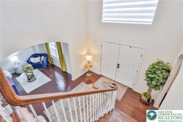 249 Danbury Dr, Upper Nazareth Twp, PA 18064 - foyer entrance featuring a high ceiling, wood finished floors, and arched walkways