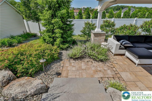 249 Danbury Dr, Upper Nazareth Twp, PA 18064 - fenced backyard with a patio and an outdoor living space