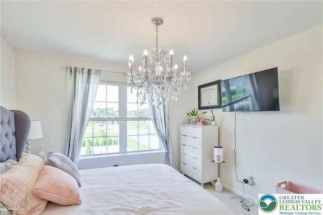 249 Danbury Dr, Upper Nazareth Twp, PA 18064 - carpeted bedroom with a chandelier and baseboards