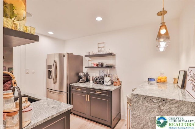 249 Danbury Dr, Upper Nazareth Twp, PA 18064 - kitchen featuring open shelves, stainless steel fridge, pendant lighting, recessed lighting, and light wood finished floors