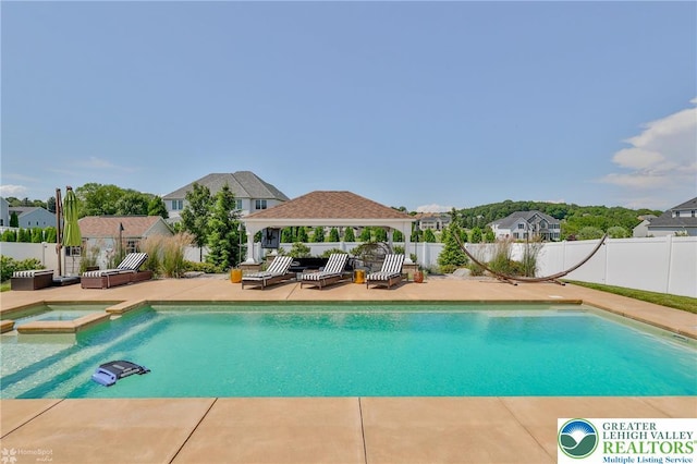 249 Danbury Dr, Upper Nazareth Twp, PA 18064 - view of pool featuring a gazebo, a pool with connected hot tub, a fenced backyard, and a patio