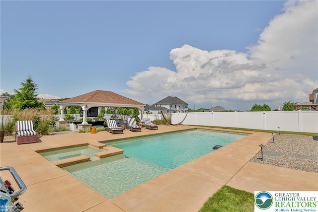 249 Danbury Dr, Upper Nazareth Twp, PA 18064 - view of swimming pool with a gazebo, a fenced backyard, a patio area, and a pool with connected hot tub