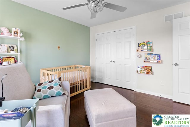 237 Danbury Dr, Upper Nazareth Twp, PA 18064 - bedroom with wood finished floors, a closet, a nursery area, and a ceiling fan