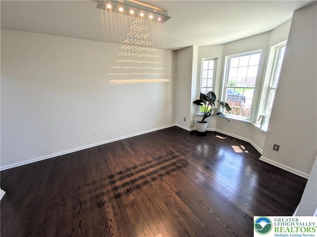 237 Danbury Dr, Upper Nazareth Twp, PA 18064 - unfurnished dining area with dark wood-style floors and baseboards