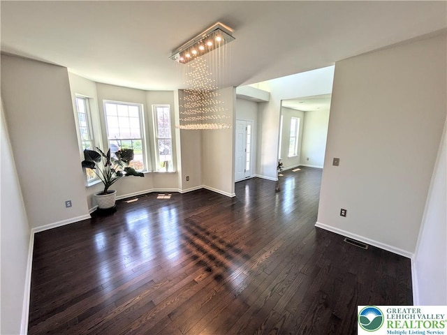 237 Danbury Dr, Upper Nazareth Twp, PA 18064 - workout room with dark wood-style flooring and baseboards