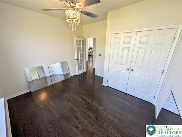 237 Danbury Dr, Upper Nazareth Twp, PA 18064 - unfurnished bedroom featuring dark wood-type flooring, a closet, french doors, and ceiling fan