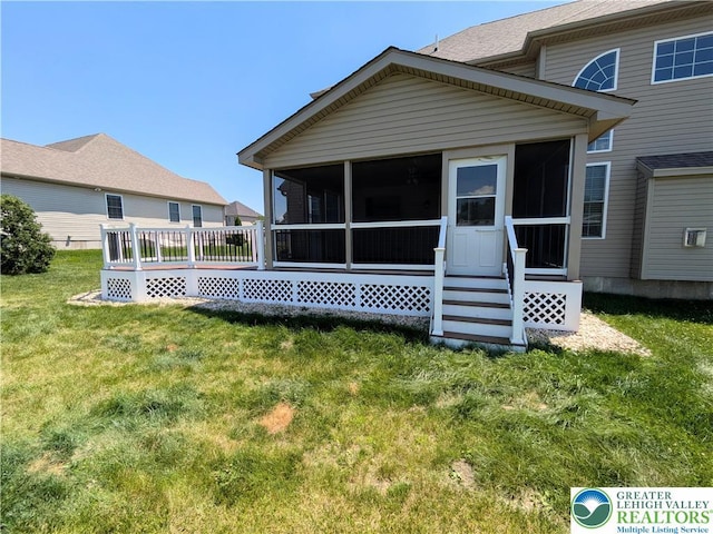 237 Danbury Dr, Upper Nazareth Twp, PA 18064 - rear view of property with a sunroom and a lawn