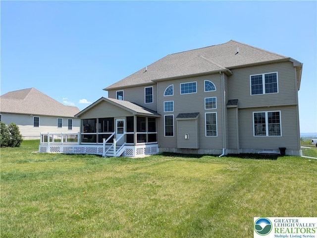 237 Danbury Dr, Upper Nazareth Twp, PA 18064 - back of house featuring a sunroom and a lawn