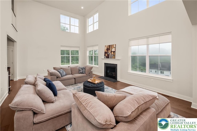 5635 Saucon Ridge Rd, Upper Saucon Twp, PA 18036 - living area with a high ceiling, wood finished floors, and a fireplace with flush hearth