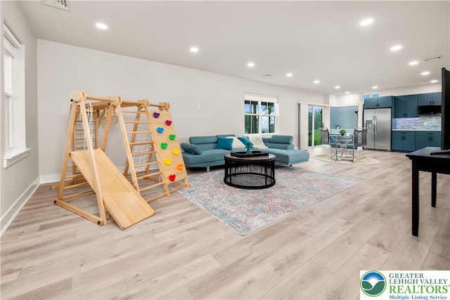 5635 Saucon Ridge Rd, Upper Saucon Twp, PA 18036 - living area with light wood-style floors, recessed lighting, and stairway