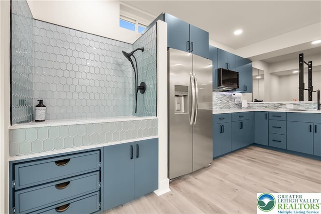 5635 Saucon Ridge Rd, Upper Saucon Twp, PA 18036 - kitchen with stainless steel fridge, blue cabinetry, light wood-style floors, light countertops, and recessed lighting