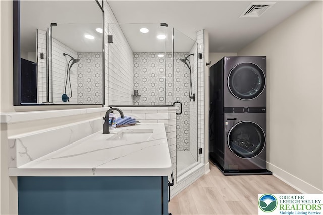 5635 Saucon Ridge Rd, Upper Saucon Twp, PA 18036 - full bath featuring stacked washer / dryer, wood finished floors, vanity, a shower stall, and recessed lighting